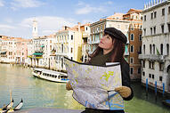 woman looking at a map in venice