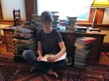 Paula surrounded by her journals