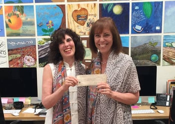Nancy Mills gifting a check to Audrey Salzburg, Chief Executive Officer of a A Window Between Worlds (AWBW).jpg