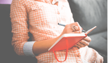 Woman Journaling in a blank book - Saving Worries for the Journal.png