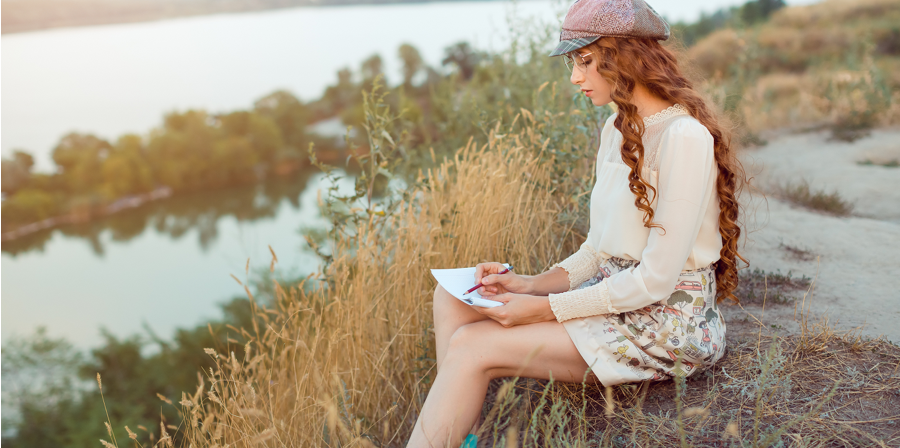 woman-journaling-on-the-beach